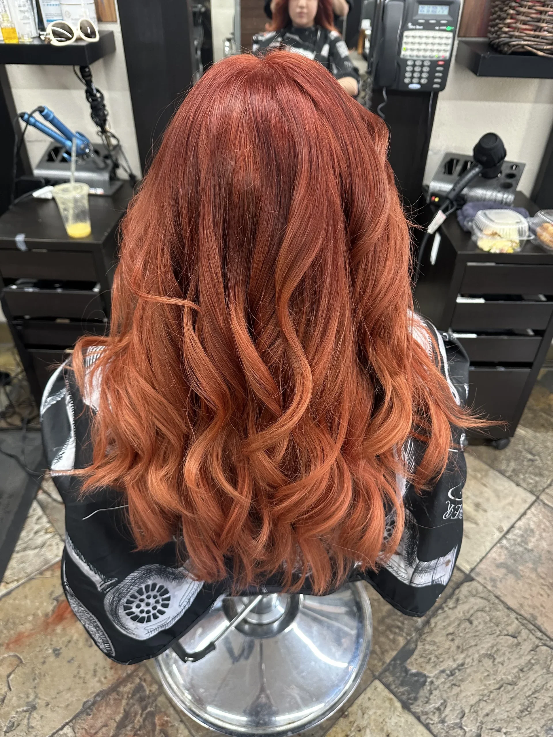 Copper red color and styled waves by Olivia Hair Studio
