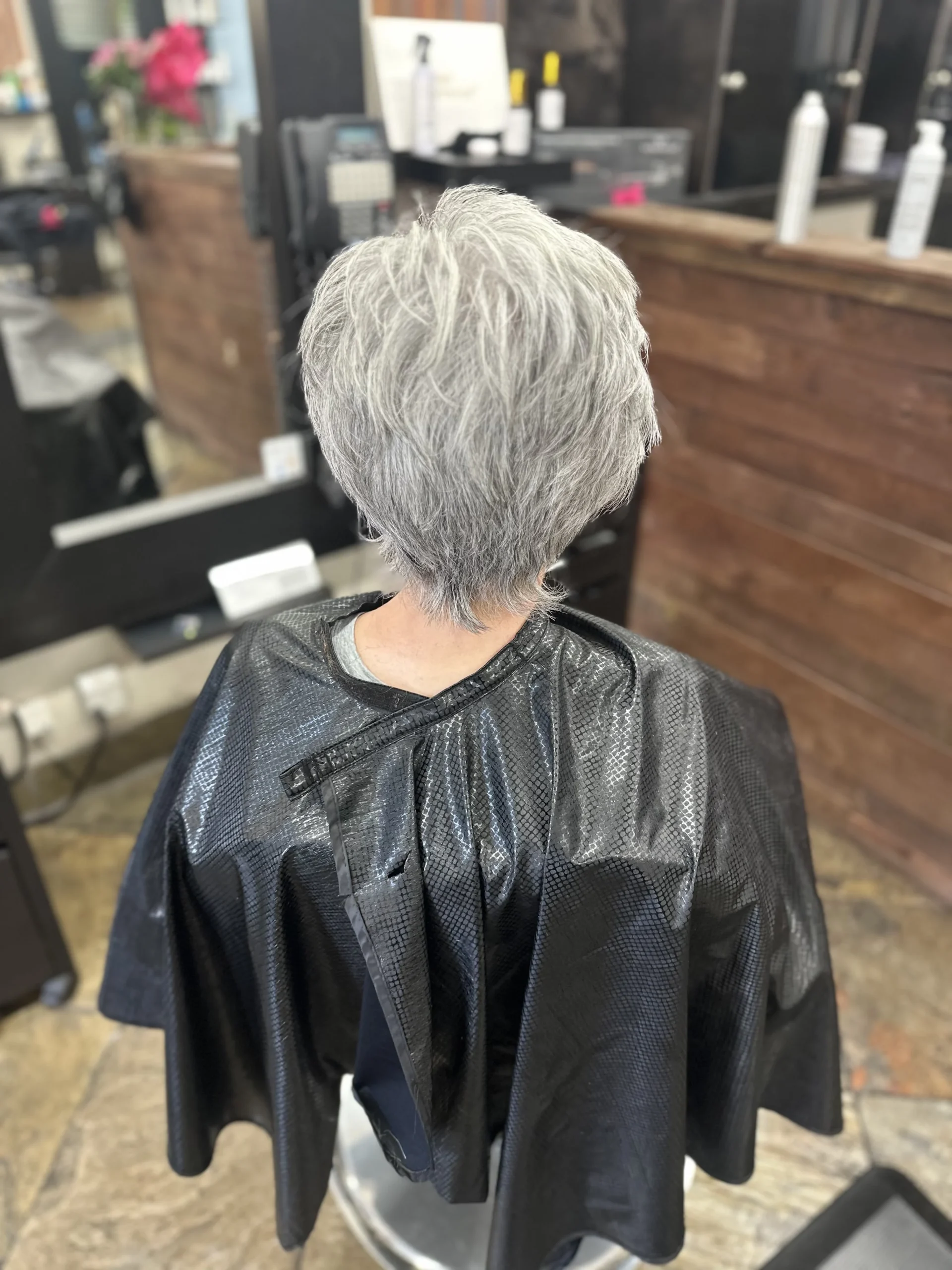 Short gray haircut by Olivia Hair Studio